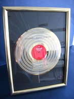 Golden gramophone record in frame.